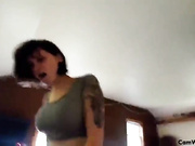 Teen with jet black hair teasing on cam