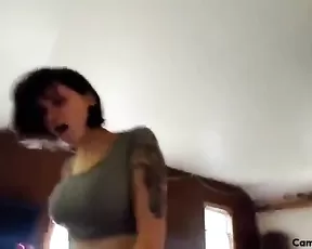 Teen with jet black hair teasing on cam